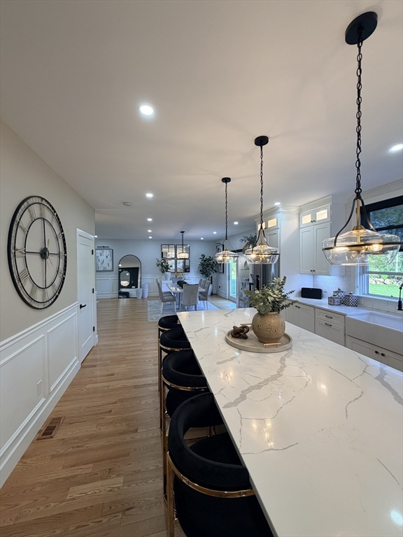 6 Rivendell Lane Millis, MA 02054 - Photo 12 of 33 a kitchen with sink and view of living room