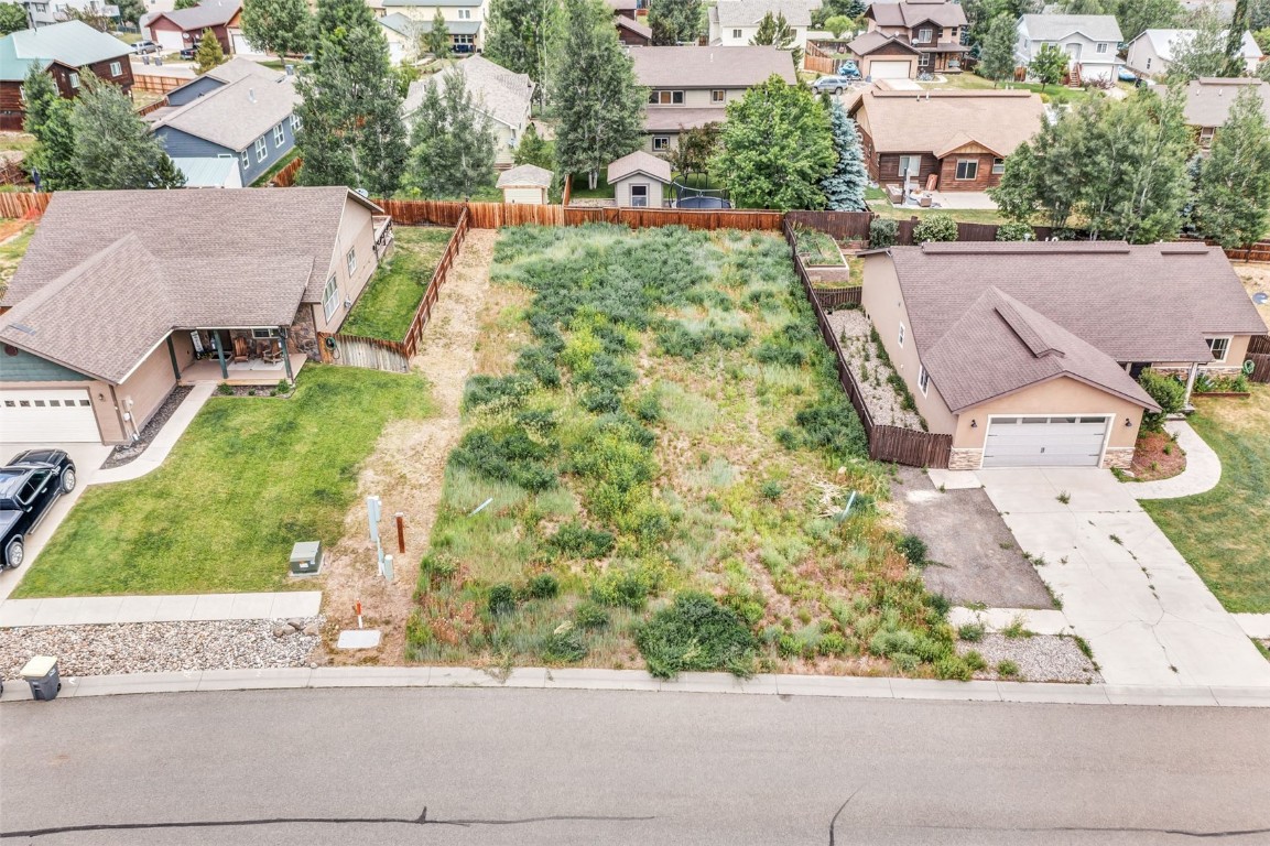 354 Lake View Road Hayden, CO 81639 - Photo 6 of 10 an aerial view of a house with a yard and a large tree