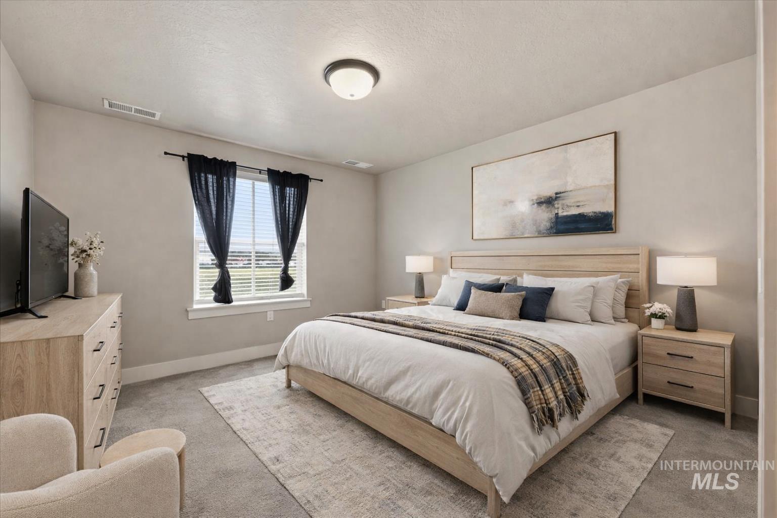 92 South Ravine Way Nampa, ID 83687 - Photo 21 of 29 Bedroom featuring light colored carpet and baseboards