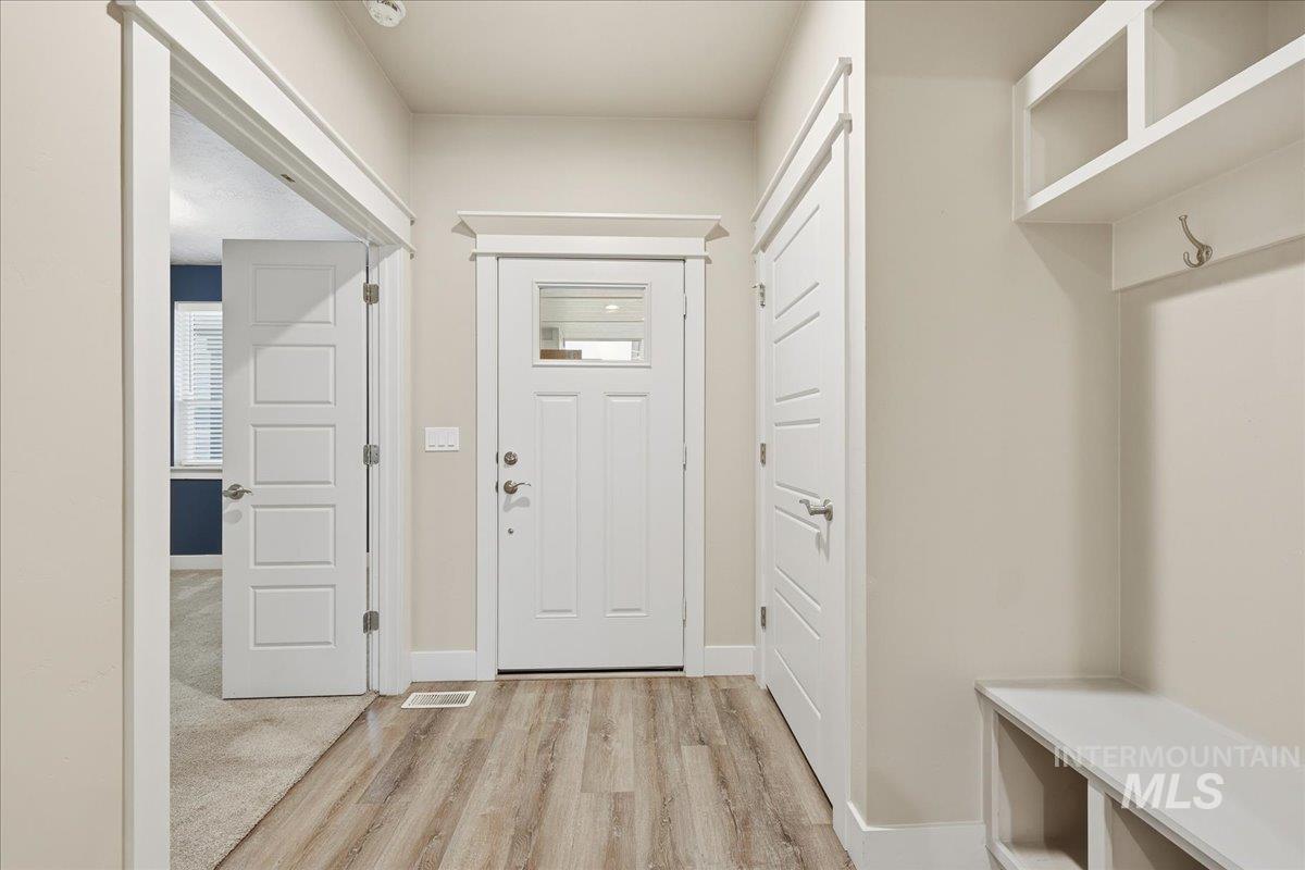 92 South Ravine Way Nampa, ID 83687 - Photo 4 of 29 Mudroom with light wood-style floors and baseboards