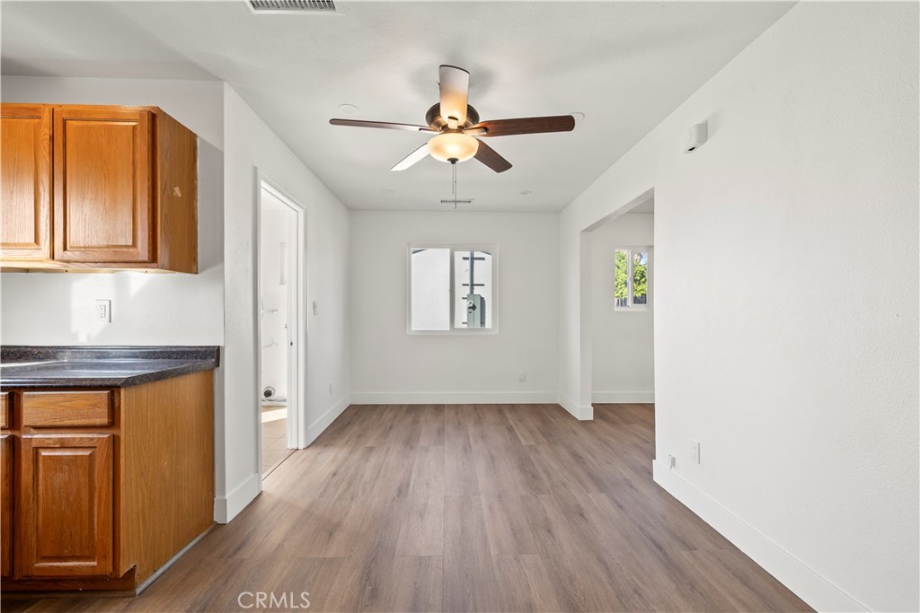 605 West 1st Street Azusa, CA 91702 - Photo 19 of 38 a view of an empty room with window and wooden floor