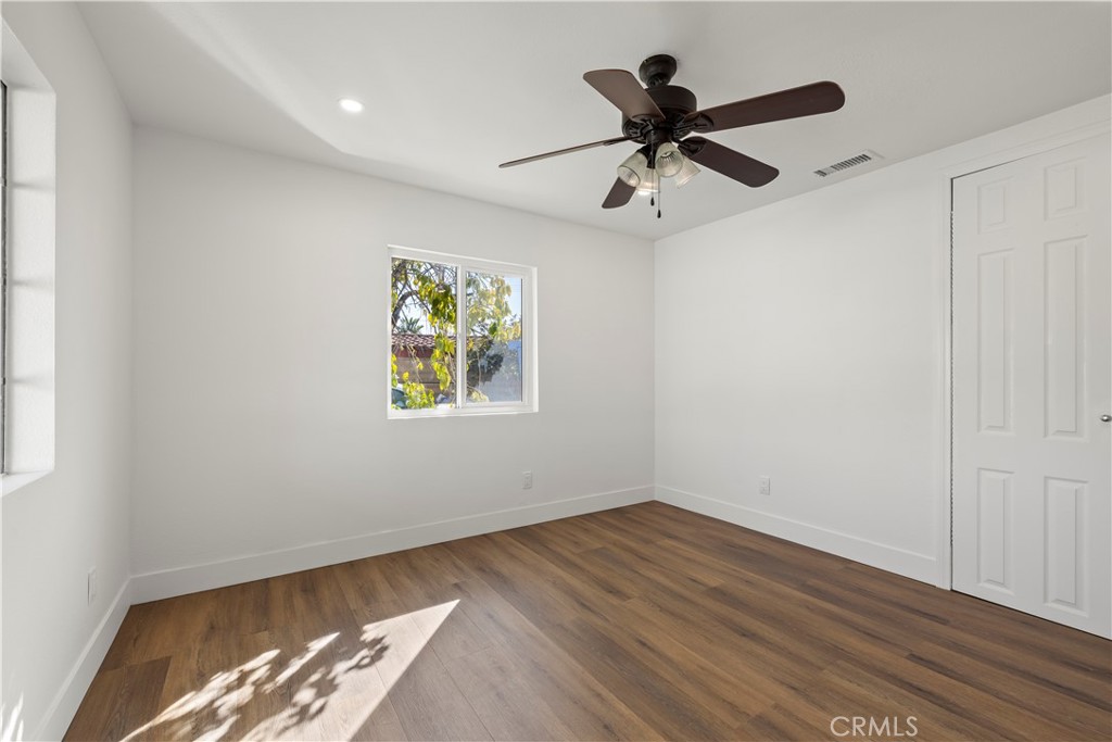 605 West 1st Street Azusa, CA 91702 - Photo 21 of 38 a view of workspace with wooden floor and ceiling fan