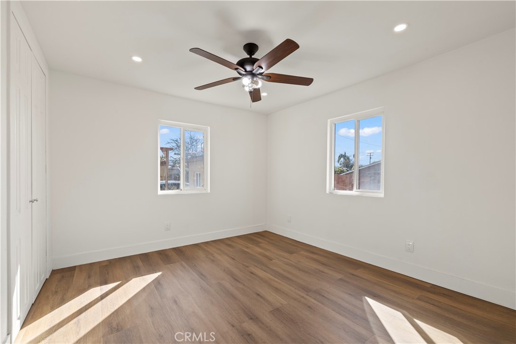 605 West 1st Street Azusa, CA 91702 - Photo 22 of 38 a view of a big room with wooden floor and windows