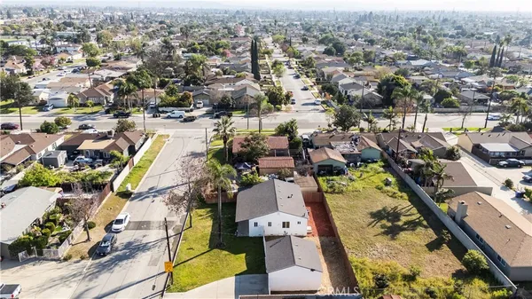 an aerial view of a house with a swimming pool