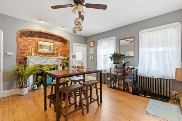 a view of a dining room with furniture and wooden floor