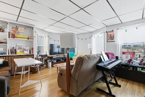 a living room with furniture and a flat screen tv