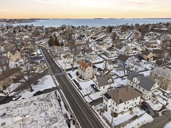 an aerial view of residential houses with outdoor space