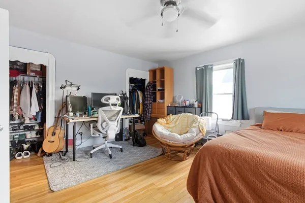 a bathroom with a sink mirror vanity and toilet