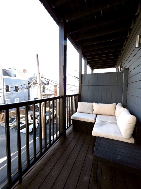 65 Border Street, Unit 4 Boston, MA 02128 - Photo 15 of 15 a view of a balcony with couch