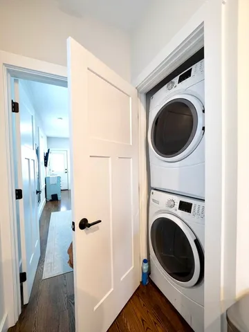 a view of a hallway with washer and dryer