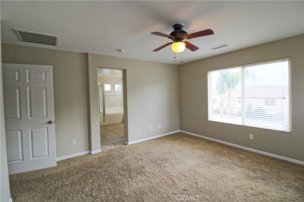 1637 Rigel Street Beaumont, CA 92223 - Photo 14 of 22 a view of an empty room with a window