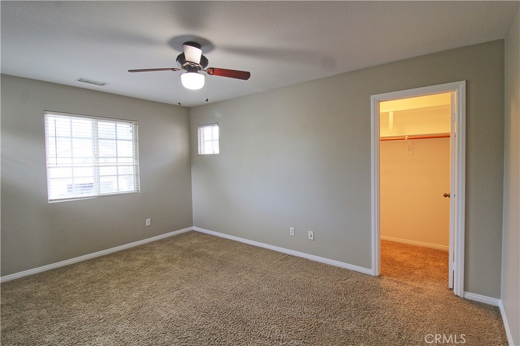 1637 Rigel Street Beaumont, CA 92223 - Photo 16 of 22 a view of an empty room with a window