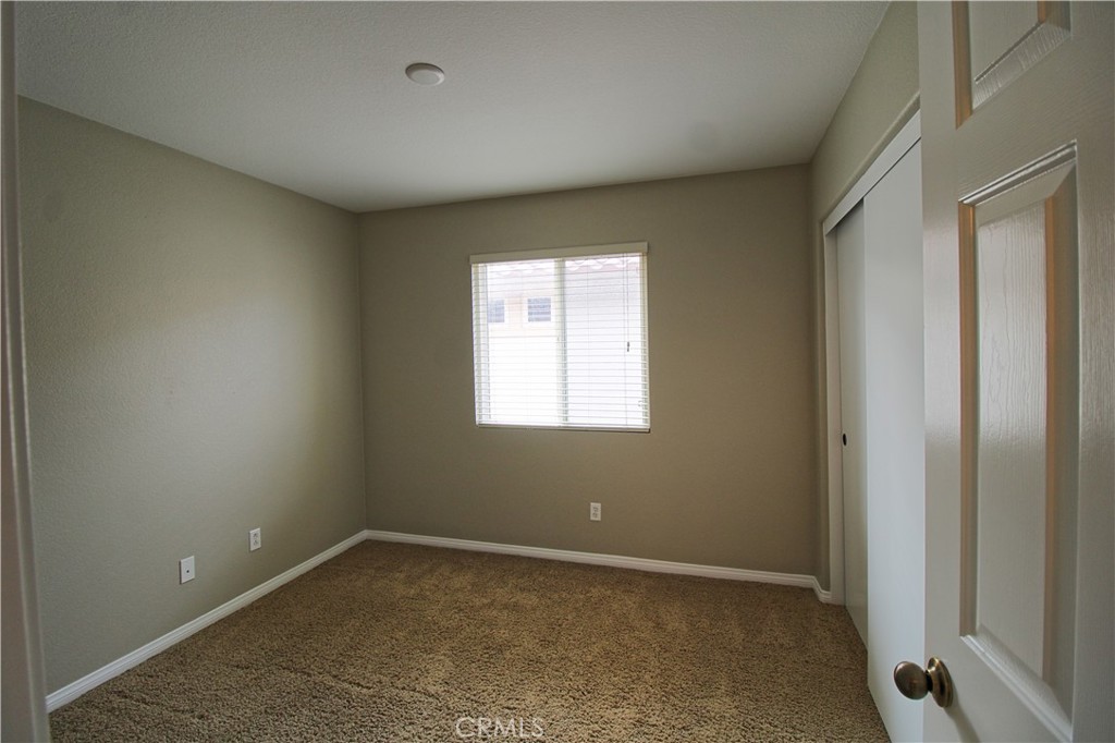 1637 Rigel Street Beaumont, CA 92223 - Photo 18 of 22 an empty room with a window