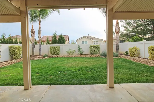 a view of a back yard from a balcony