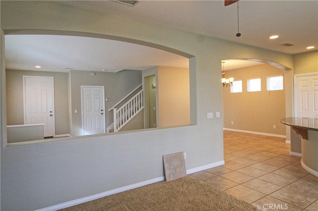 1637 Rigel Street Beaumont, CA 92223 - Photo 8 of 22 a view of a hallway with windows