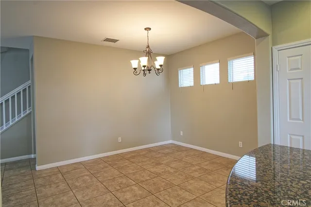 a view of a livingroom with a chandelier fan