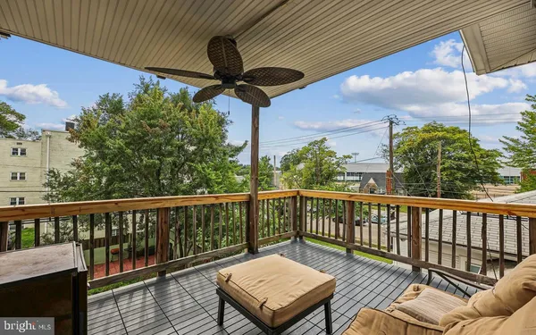 a view of a balcony with furniture