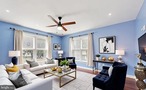 a living room with furniture and a window