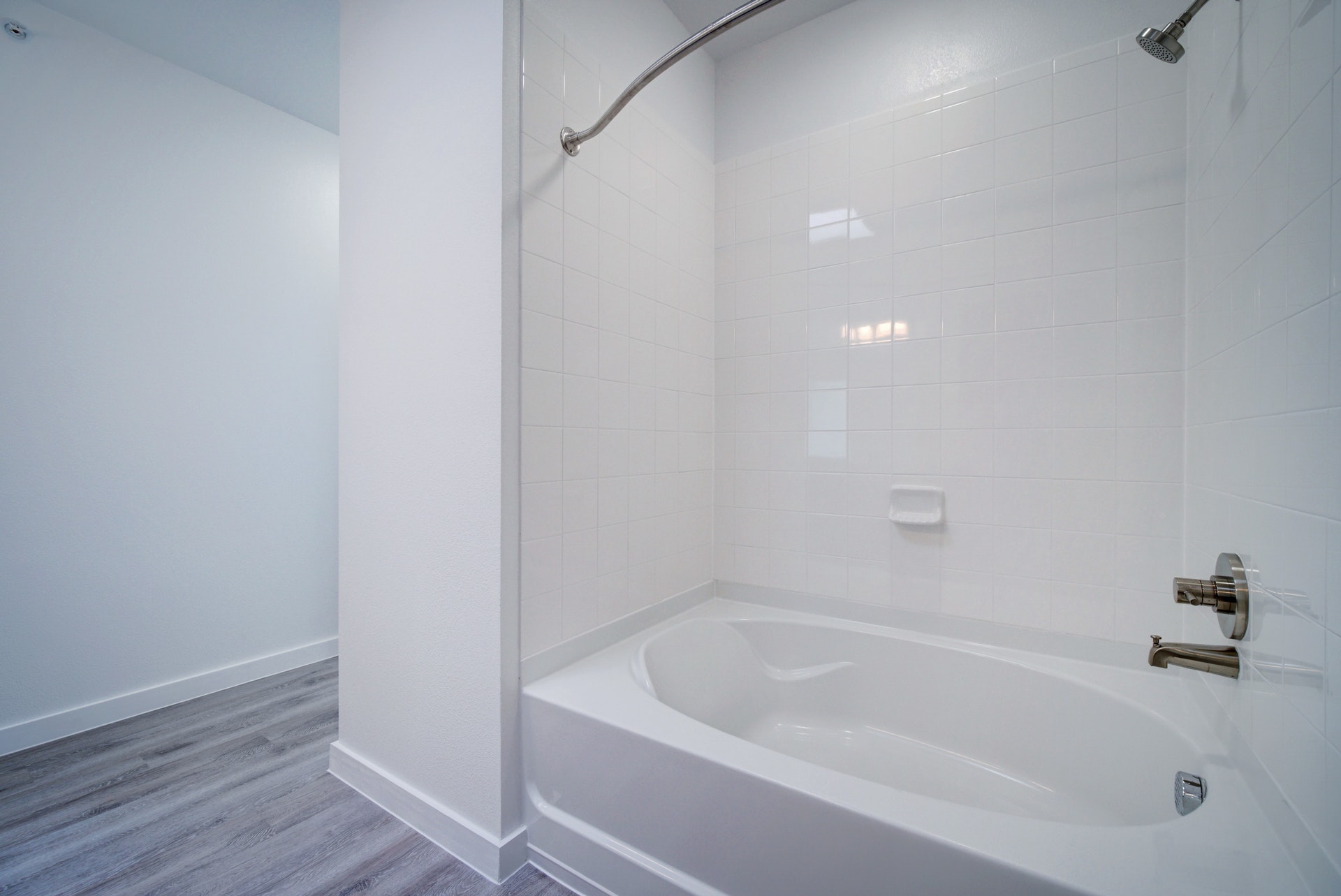 13130 Pond Springs Road, Unit 3214 Austin, TX 78729 - Photo 25 of 40 Full bathroom with shower combination and wood finished floors
