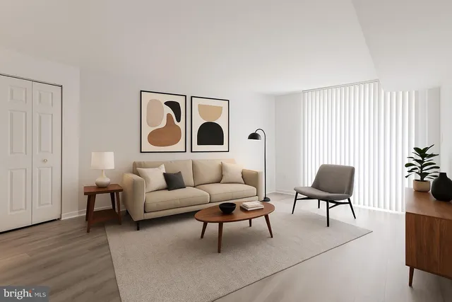 a living room with furniture and a chair