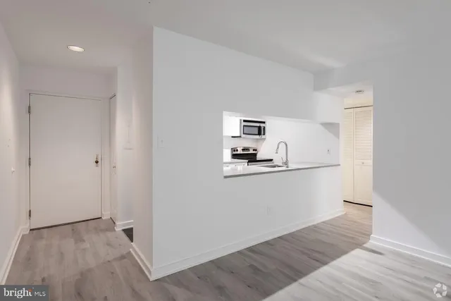 a view of kitchen and wooden floor
