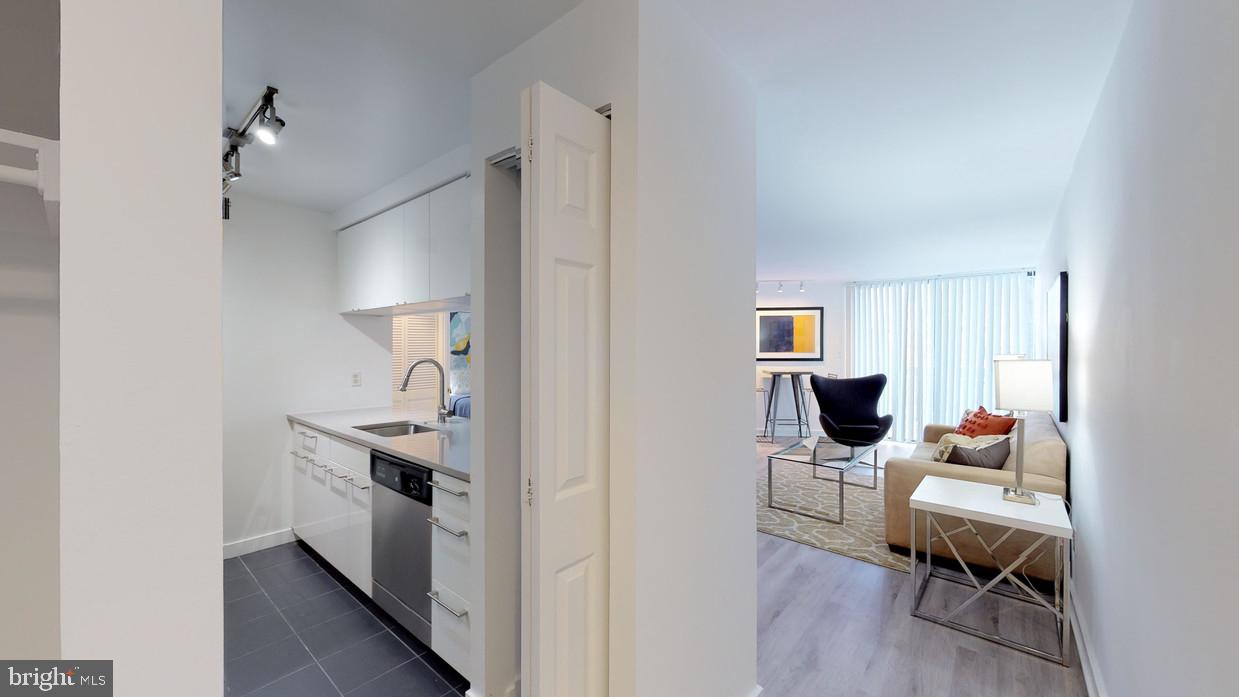 601 24th Street Northwest, Unit 301 Washington, DC 20037 - Photo 6 of 8 a view of living room filled with furniture and wooden floor