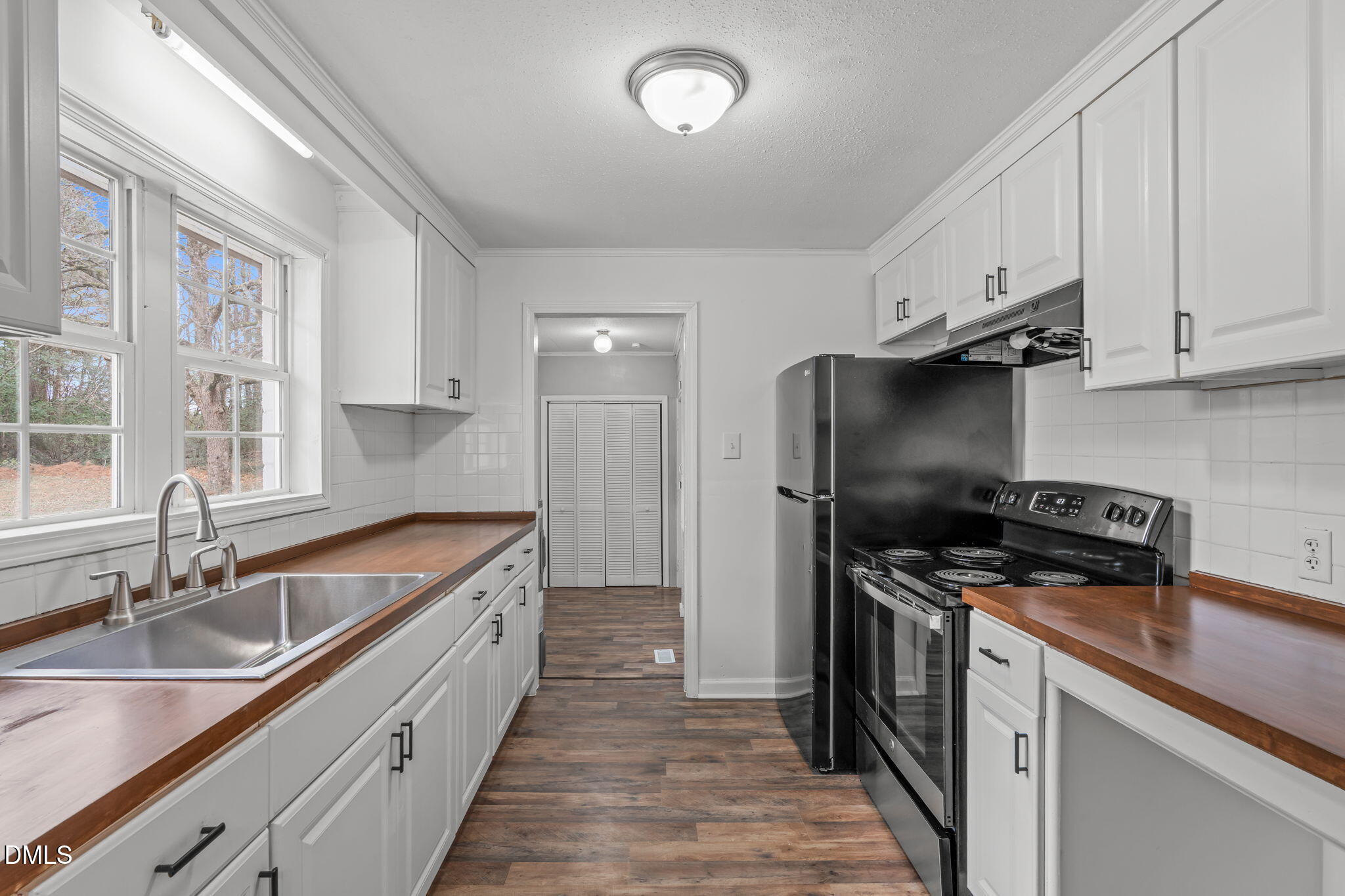 311 New Rand Road Garner, NC 27529 - Photo 10 of 31 a kitchen that has a sink and a stove