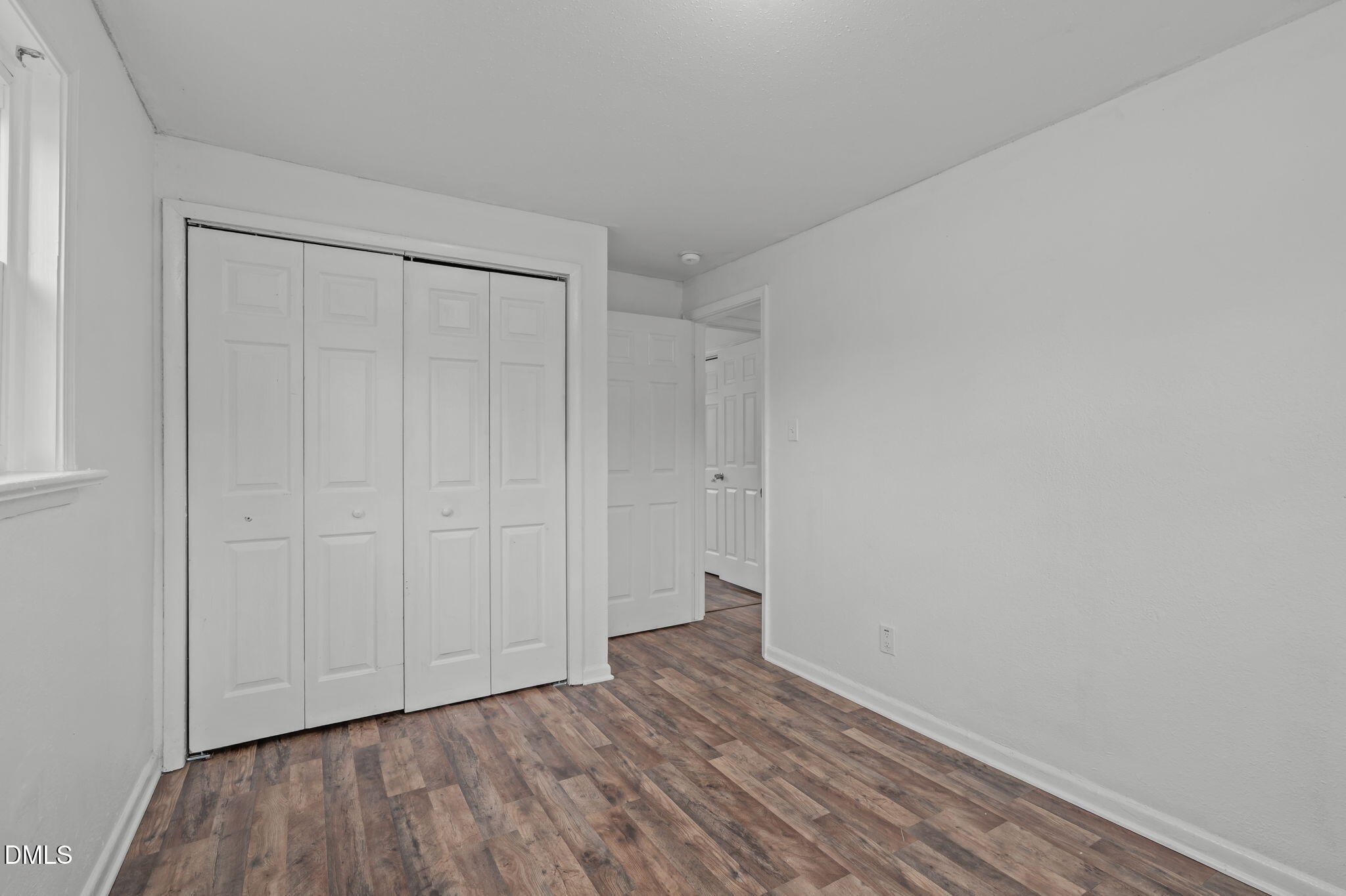 311 New Rand Road Garner, NC 27529 - Photo 13 of 31 a view of an empty room and wooden floor