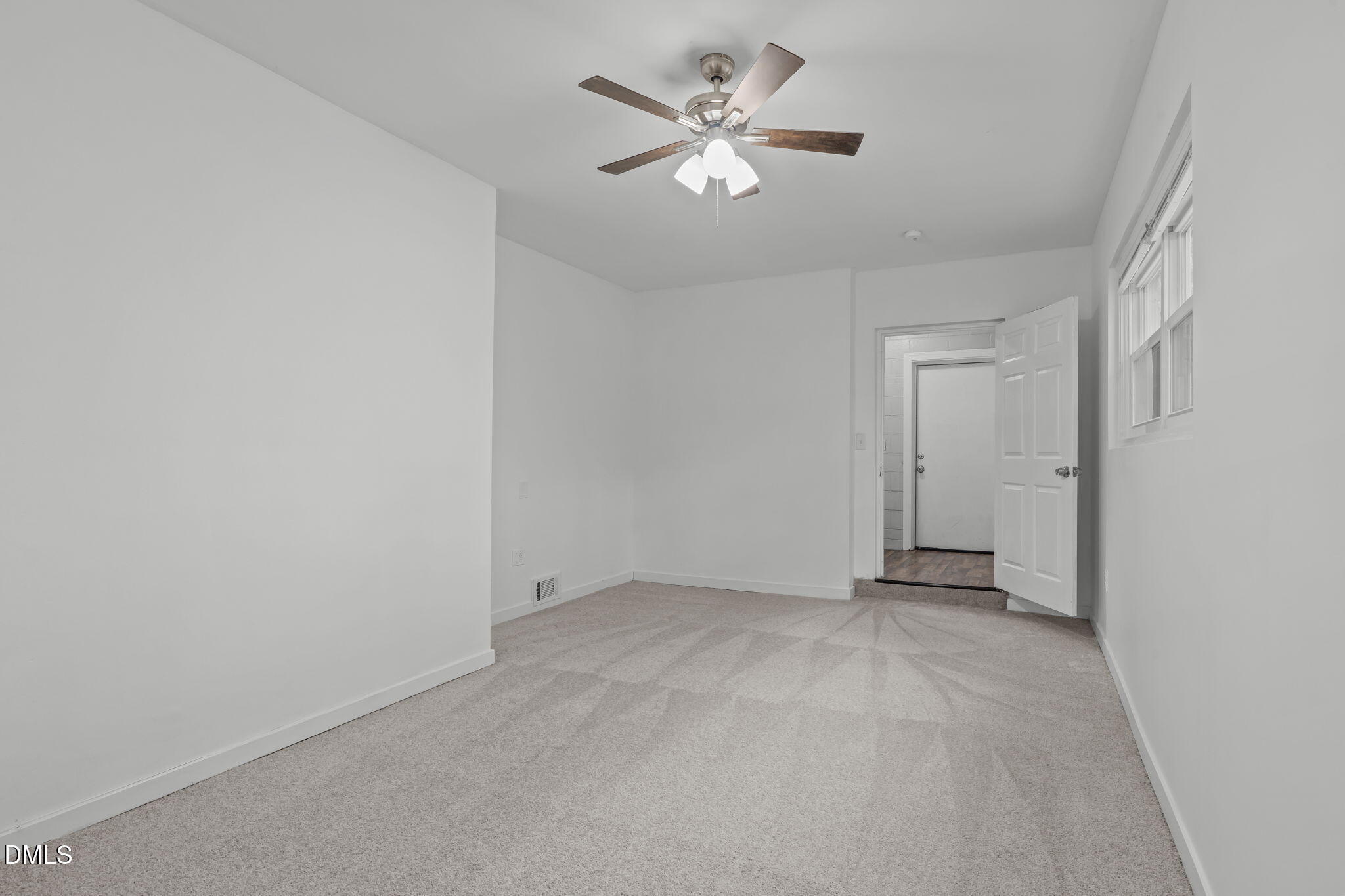 311 New Rand Road Garner, NC 27529 - Photo 15 of 31 an empty room with chandelier fan