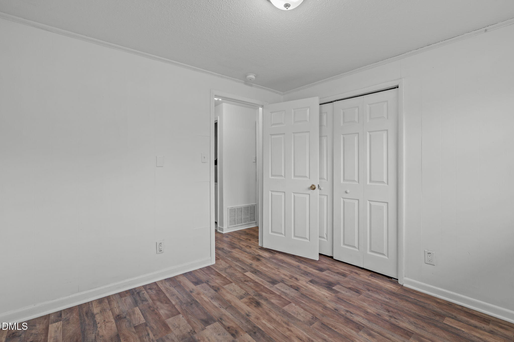 311 New Rand Road Garner, NC 27529 - Photo 18 of 31 a view of an empty room and wooden floor