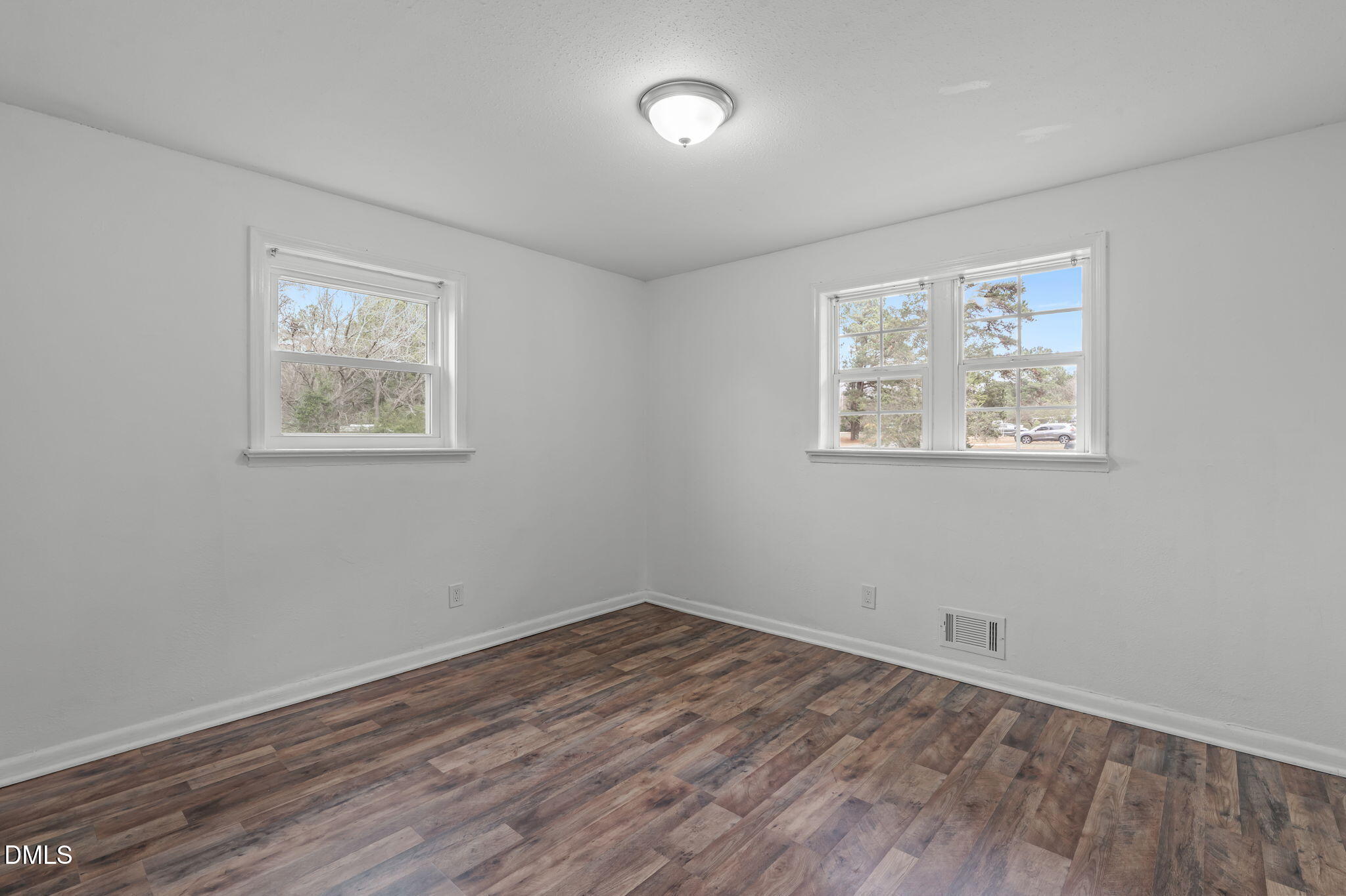 311 New Rand Road Garner, NC 27529 - Photo 19 of 31 a view of empty room with wooden floor