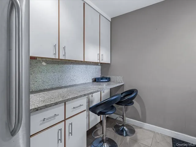 a room with cabinets and piano table