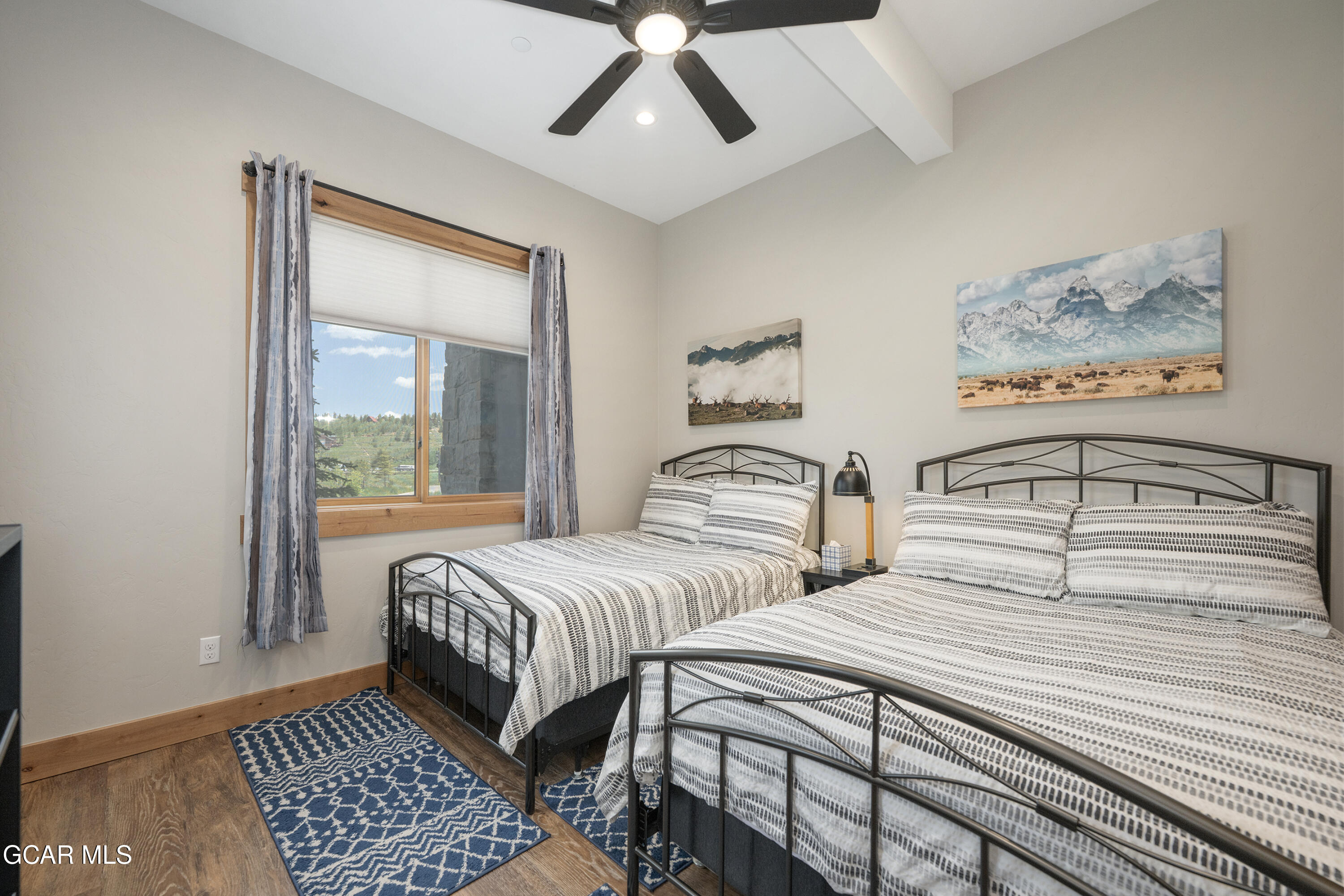 40 Springview Lane Fraser, CO 80442 - Photo 24 of 36 a bedroom with beds and a window