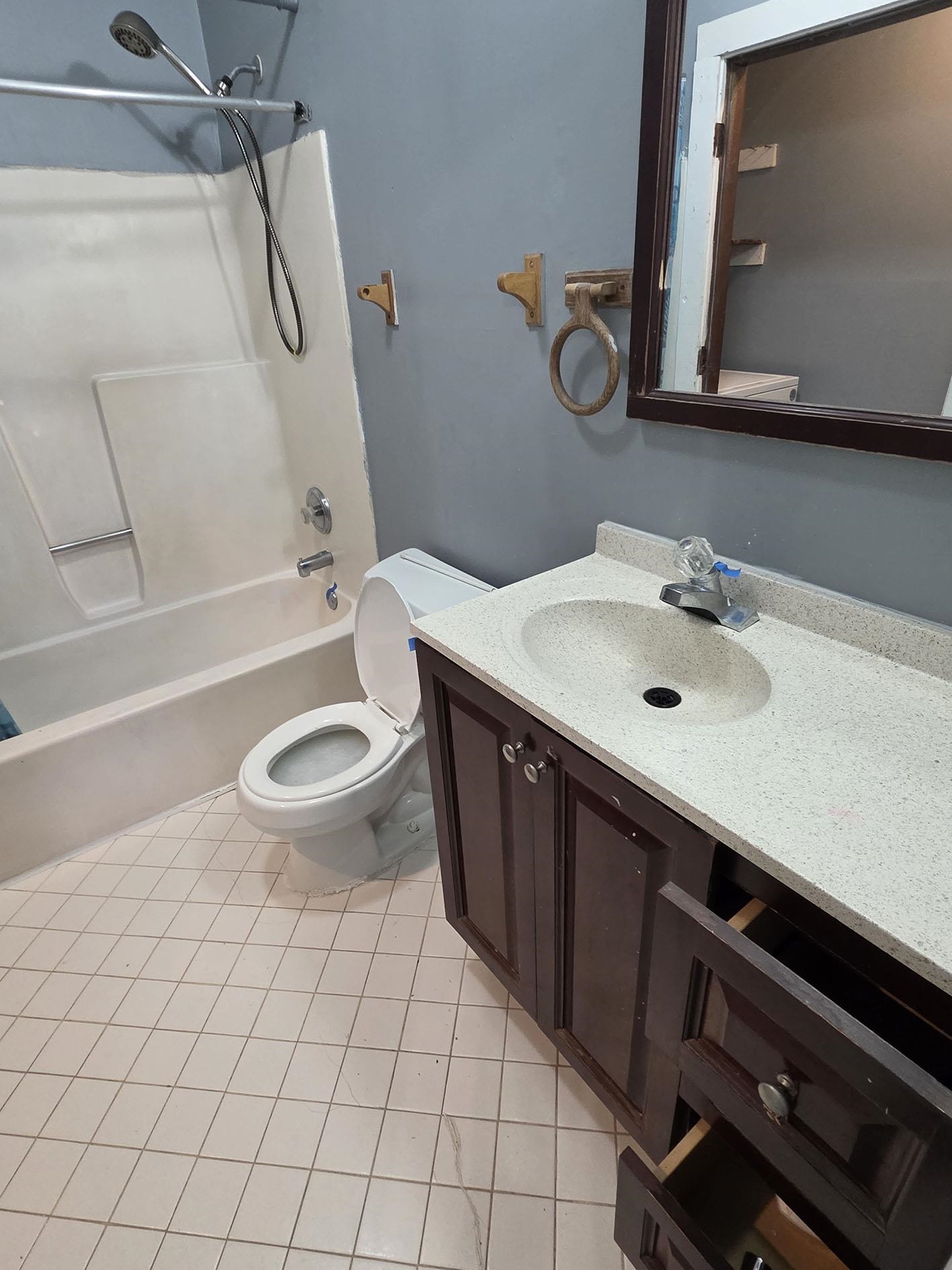 6521 Wimble Road Memphis, TN 38134 - Photo 6 of 18 Full bath featuring vanity, light tile patterned floors, and shower / bathtub combination
