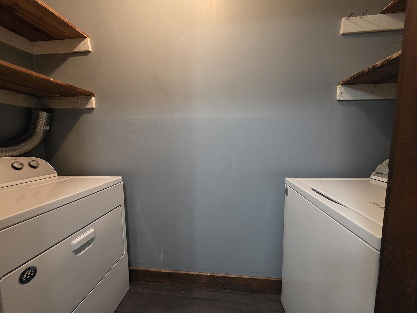 6521 Wimble Road Memphis, TN 38134 - Photo 9 of 18 Washroom featuring washer and clothes dryer and dark wood-style flooring