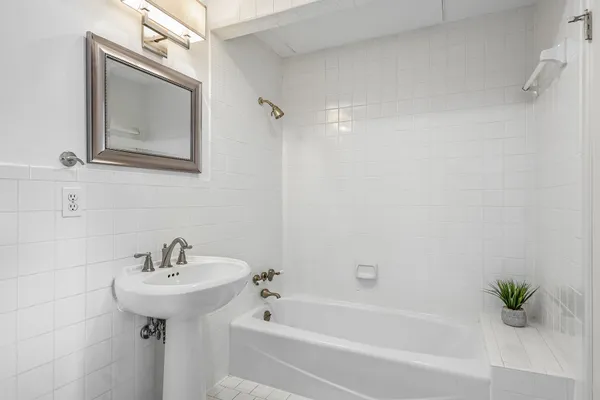 a bathroom with a sink and a bathtub