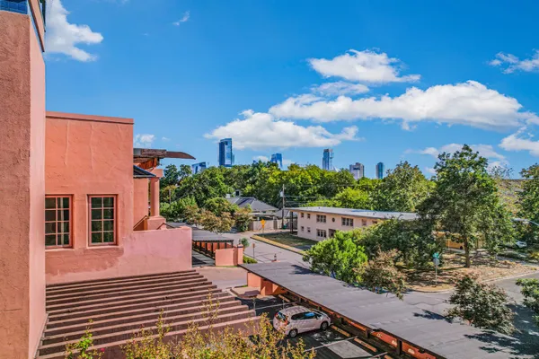 a balcony with an outdoor seating