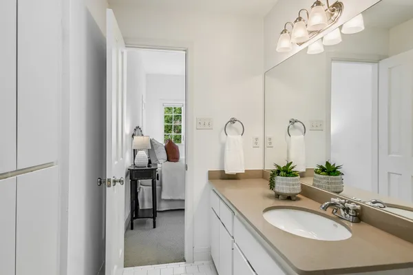 a bathroom with a double vanity sink and a mirror