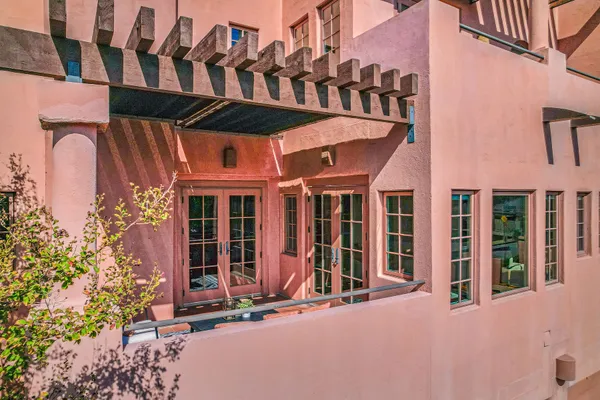 a front view of a building with glass windows and door