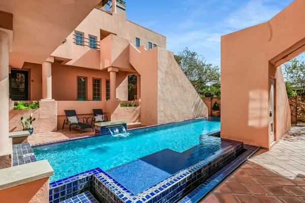 a view of a backyard with sitting area
