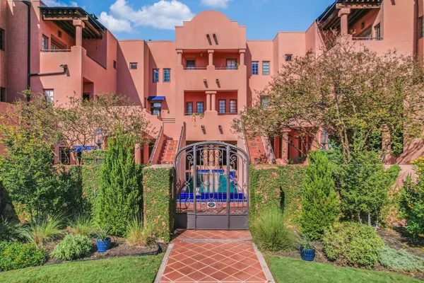 a view of building with yard and entertaining space