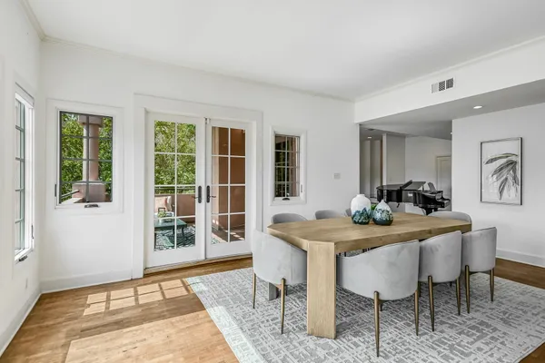 a view of a dining room with furniture window and wooden floor