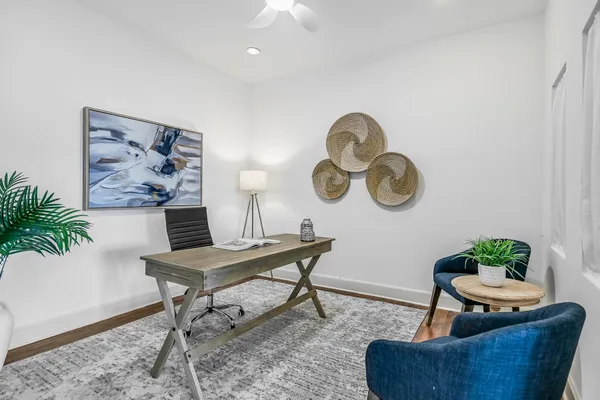 a view of a livingroom with furniture and a table