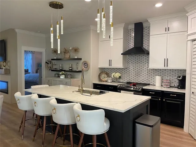 a view of walk in closet with clothes