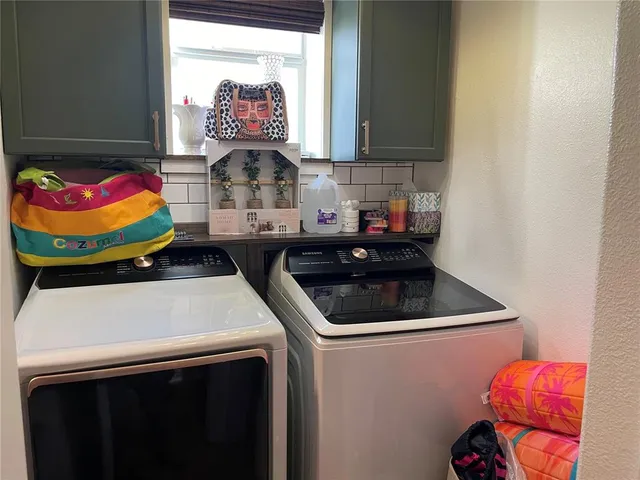 a en suite bathroom with a double vanity sink and a mirror