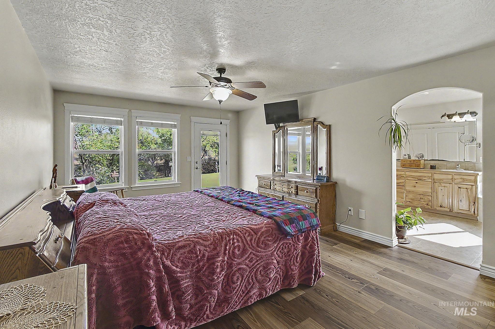 6900 West Charters Lane Melba, ID 83641 - Photo 28 of 49 Wood-finish flooring with a ceiling fan