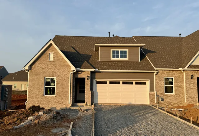 a front view of a house with yard