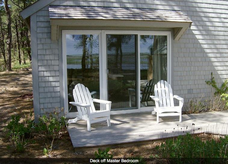 165 Baker Road Wellfleet, MA 02667 - Photo 17 of 20 a view of a two chairs in the patio