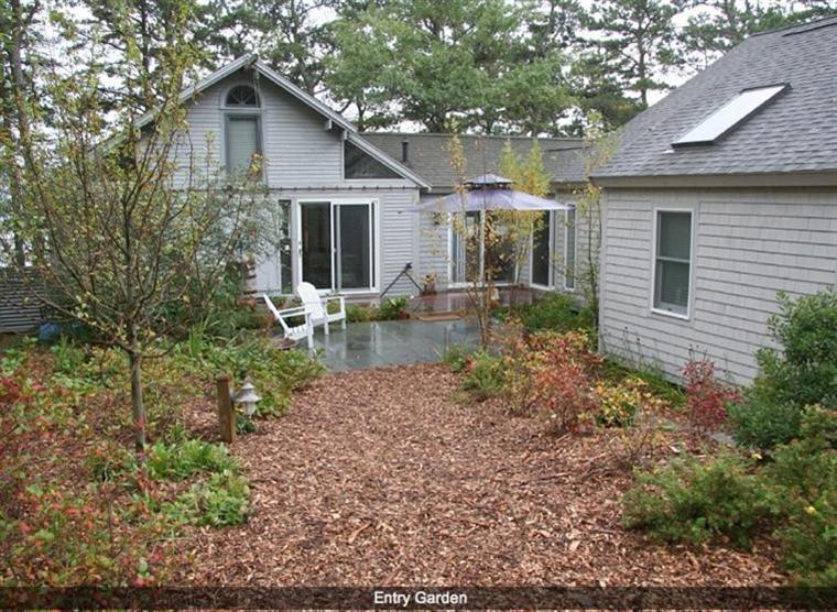 165 Baker Road Wellfleet, MA 02667 - Photo 3 of 20 a front view of a house with garden