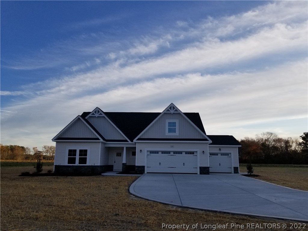 5120-lot2 J T Matthews Road Godwin, NC 28344 - Photo 1 of 5 front view of a house with a yard